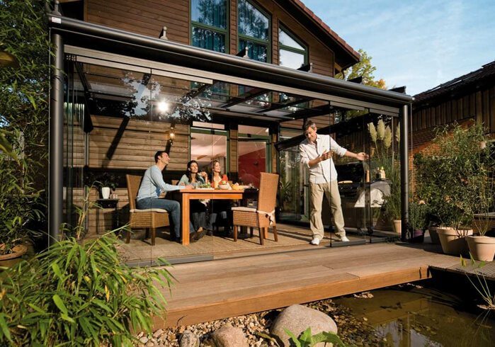 glass room four people outdoor Garden socialising in the garden